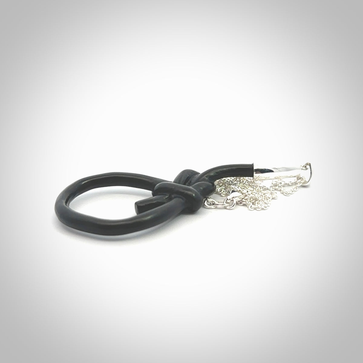 A gorgeous hand carved black jade bowline knot pendant with sterling silver. Hand made in Black Jade with Sterling Silver and provided with sterling silver chain.