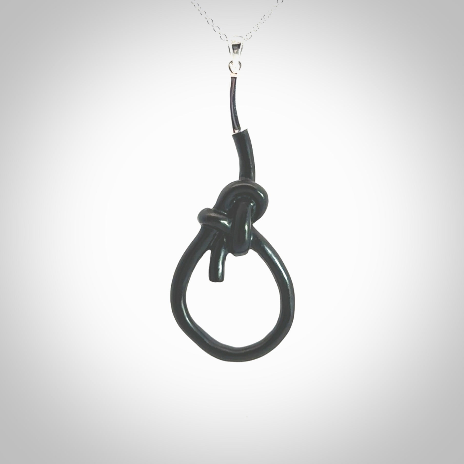 A gorgeous hand carved black jade bowline knot pendant with sterling silver. Hand made in Black Jade with Sterling Silver and provided with sterling silver chain.