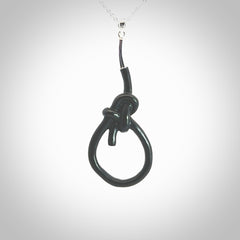 A gorgeous hand carved black jade bowline knot pendant with sterling silver. Hand made in Black Jade with Sterling Silver and provided with sterling silver chain.