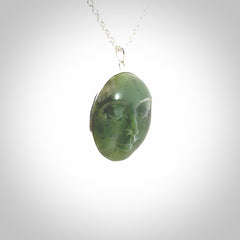 Hand made New Zealand Jade moon face necklace with Sterling Silver. Made by NZ Pacific and sale online only. Delivered with sterling silver chain and packaged in a woven kete pouch.