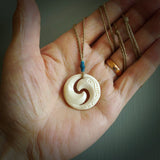 Carved koru pendant hand made in Woolly Mammoth tusk. These are a variety of colours from cream to dark brown.