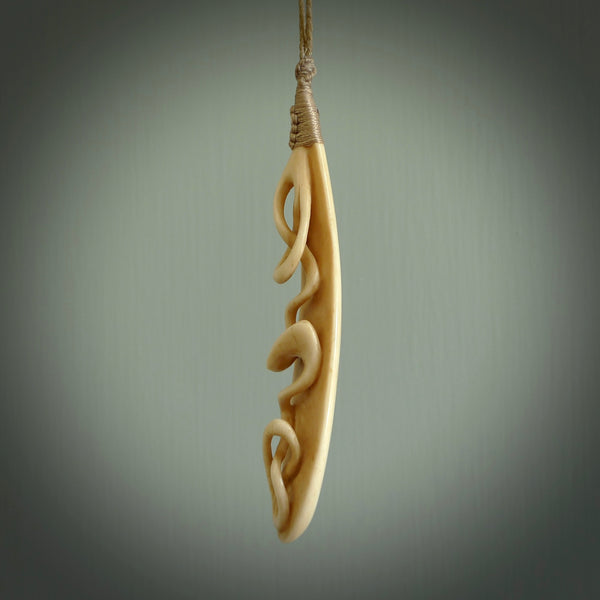 A handcarved masterpiece. A complex twist pendant carved from bone by Yuri Terenyi for NZ Pacific. This is a true piece of wearable art which is collectible. A one-off masterpiece and quite unique. Delivered with Express Courier and gift wrapped in a woven kete pouch.