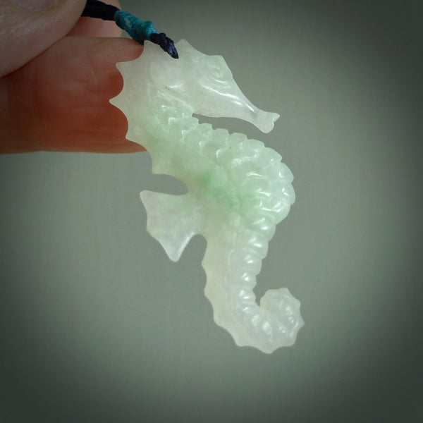 A hand carved Jadeite seahorse pendant. We have carved this from beautiful jadeite and we bind them with our hand-plaited cords. The cords are a waxed polyester so they are durable and strong. We ship these worldwide with express courier anywhere in the world.