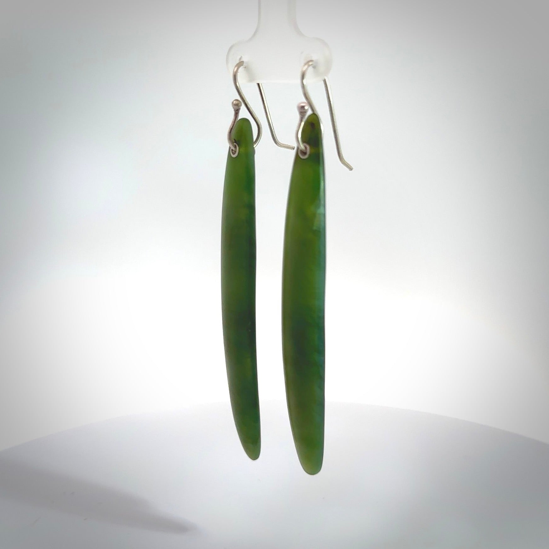 These are stunning large drop shaped jade earrings carved in New Zealand by Josey Coyle. It is carved from a apple green piece of New Zealand Jade and with Sterling Silver hooks.