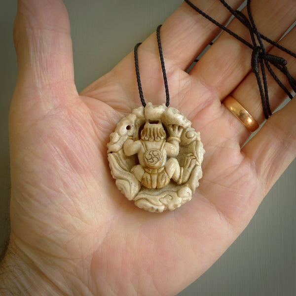 Hand carved Raiden Pendant. Made from Red Deer antler in New Zealand. Unique Japanese necklace hand made from deer antler by master bone carver Fumio Noguchi. Spectacular collectable work of art, made to wear. One only pendant, delivered to you at no extra cost with express courier.