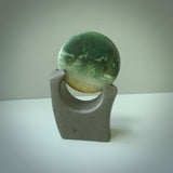 Hand carved New Zealand Marsden Jade Disc with Greywacke stand sculpture. Hand carved here in New Zealand by Ric Moor. This is a 'one only' sculpture, a beautiful display piece.