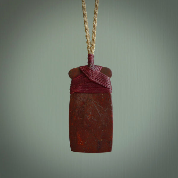 This is a beautiful hand carved Red Jasper Stone toki pendant. A really cool piece that is made from this rare and beautiful material. The red jasper has a very distinctive look and each piece is different. We ship this worldwide and the cost of shipping is included in the price.