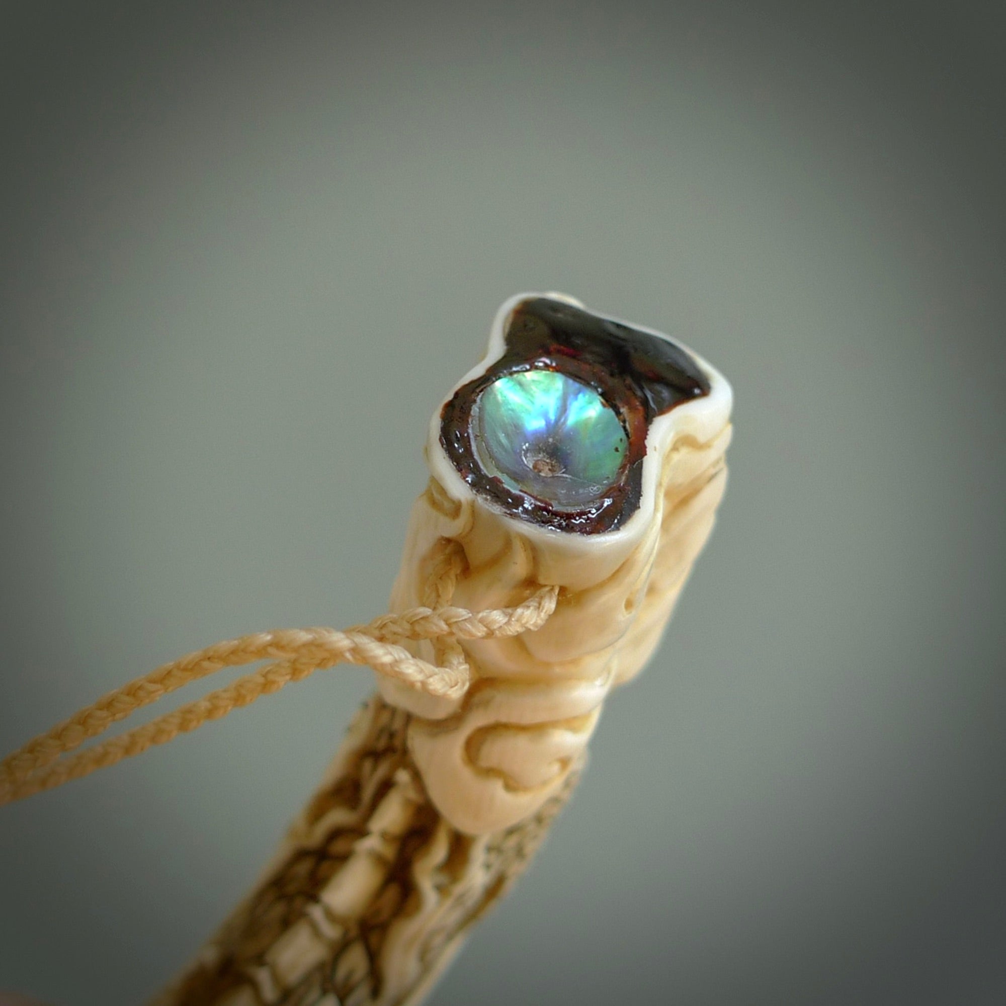 Hand carved dragon Pendant. Made from warthog tusk in New Zealand. Unique dragon necklace hand made from warthog tusk by master bone carver Fumio Noguchi. Spectacular collectable work of art, made to wear. One only pendant, delivered to you at no extra cost with express courier.