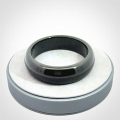 Hand carved black jade bangle. Carved from black jade. This is a solid jade bangle carved from a single piece of jade. It is polished to a soft shine. The jade is otherwise untreated and completely natural.