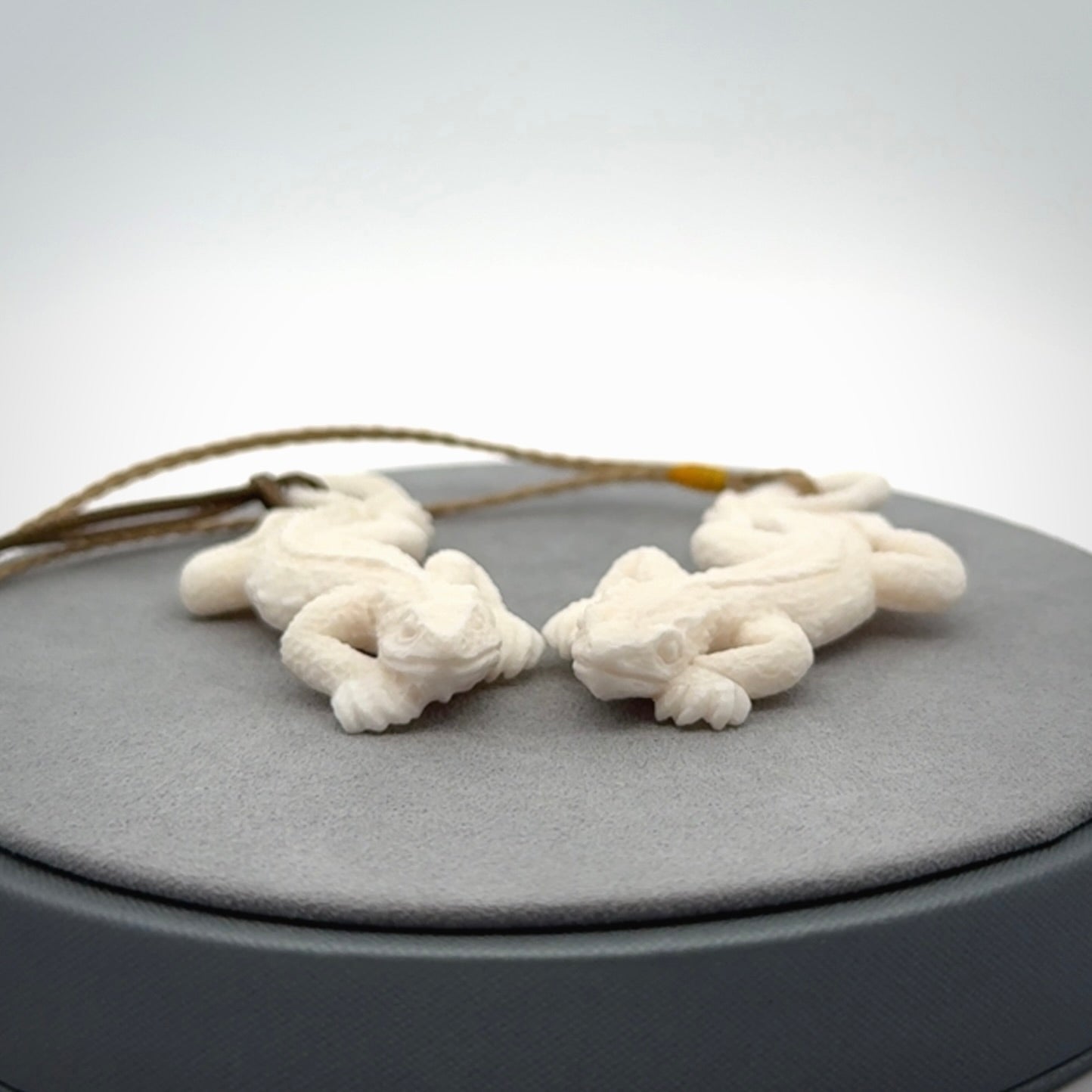 Hand carved bone Tuatara pendant.