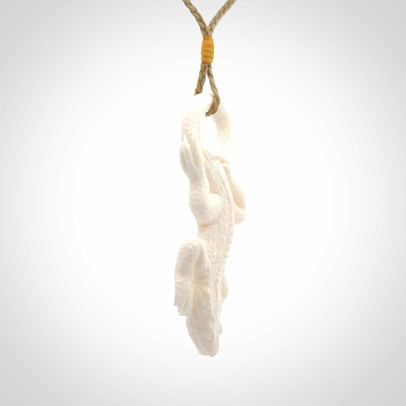 Hand carved bone Tuatara pendant.