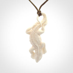 Hand carved bone Tuatara pendant.