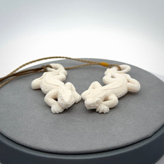 Hand carved bone Tuatara pendant.