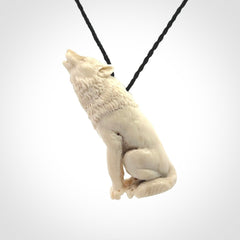 Hand carved bone wolf pendant.