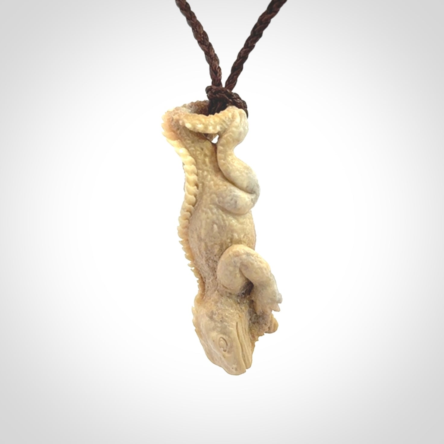 Hand carved deer antler Tuatara pendant.