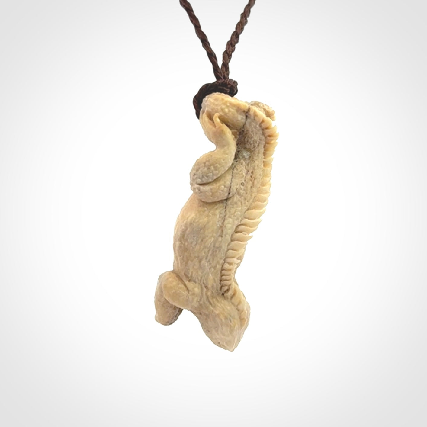 Hand carved deer antler Tuatara pendant.