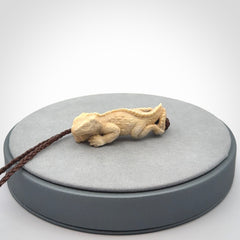 Hand carved deer antler Tuatara pendant.