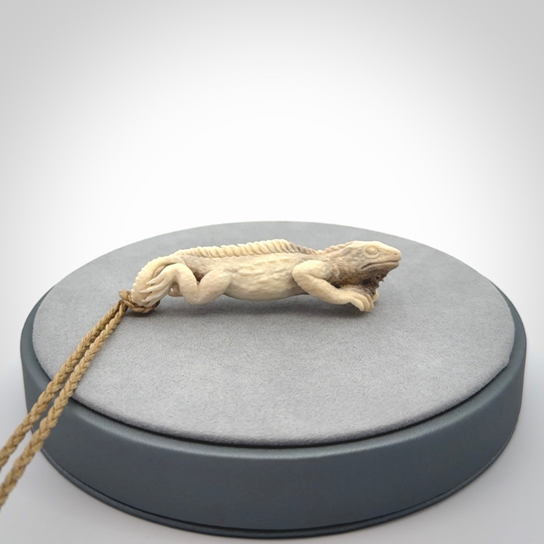 Hand carved deer antler Tuatara pendant.