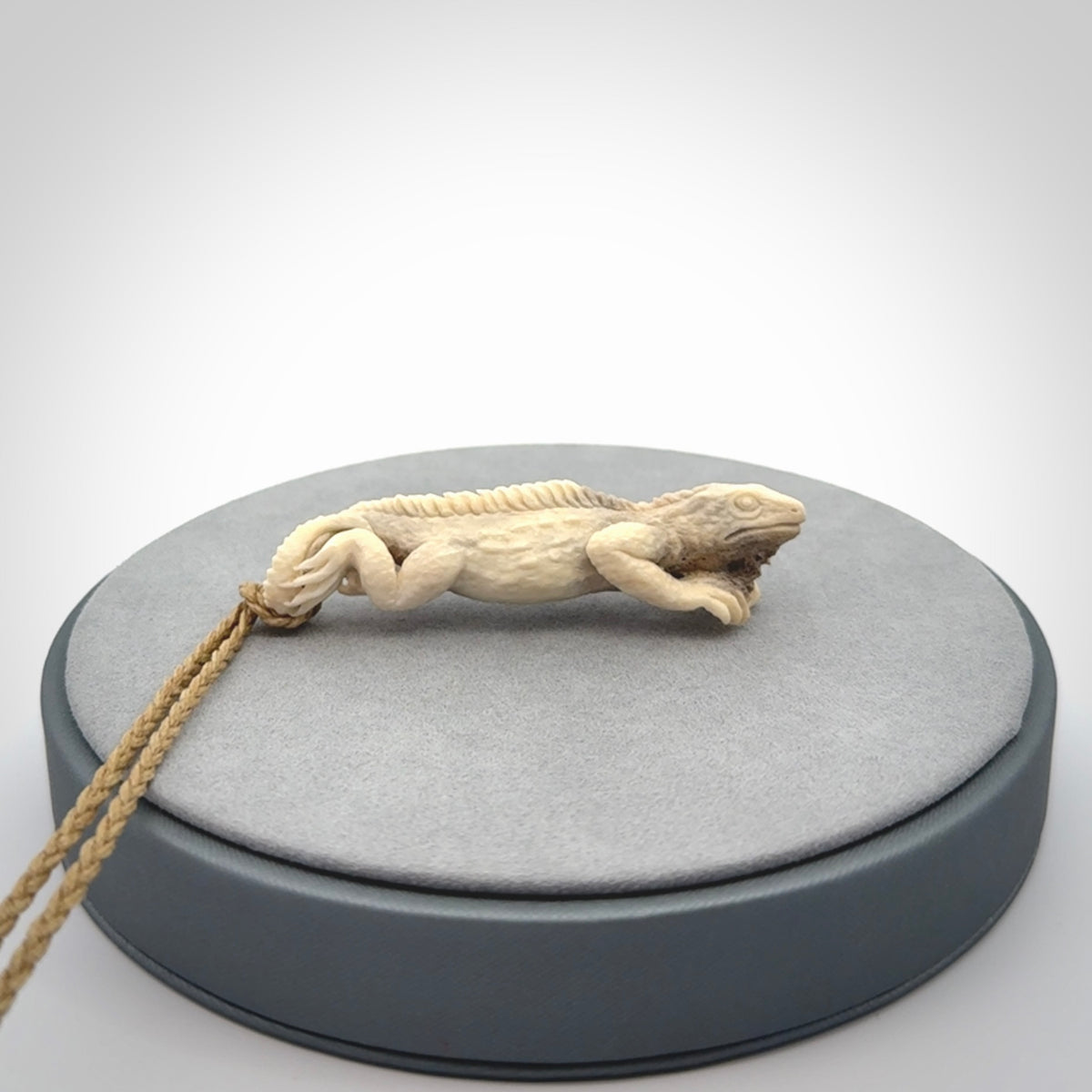 Hand carved deer antler Tuatara pendant.