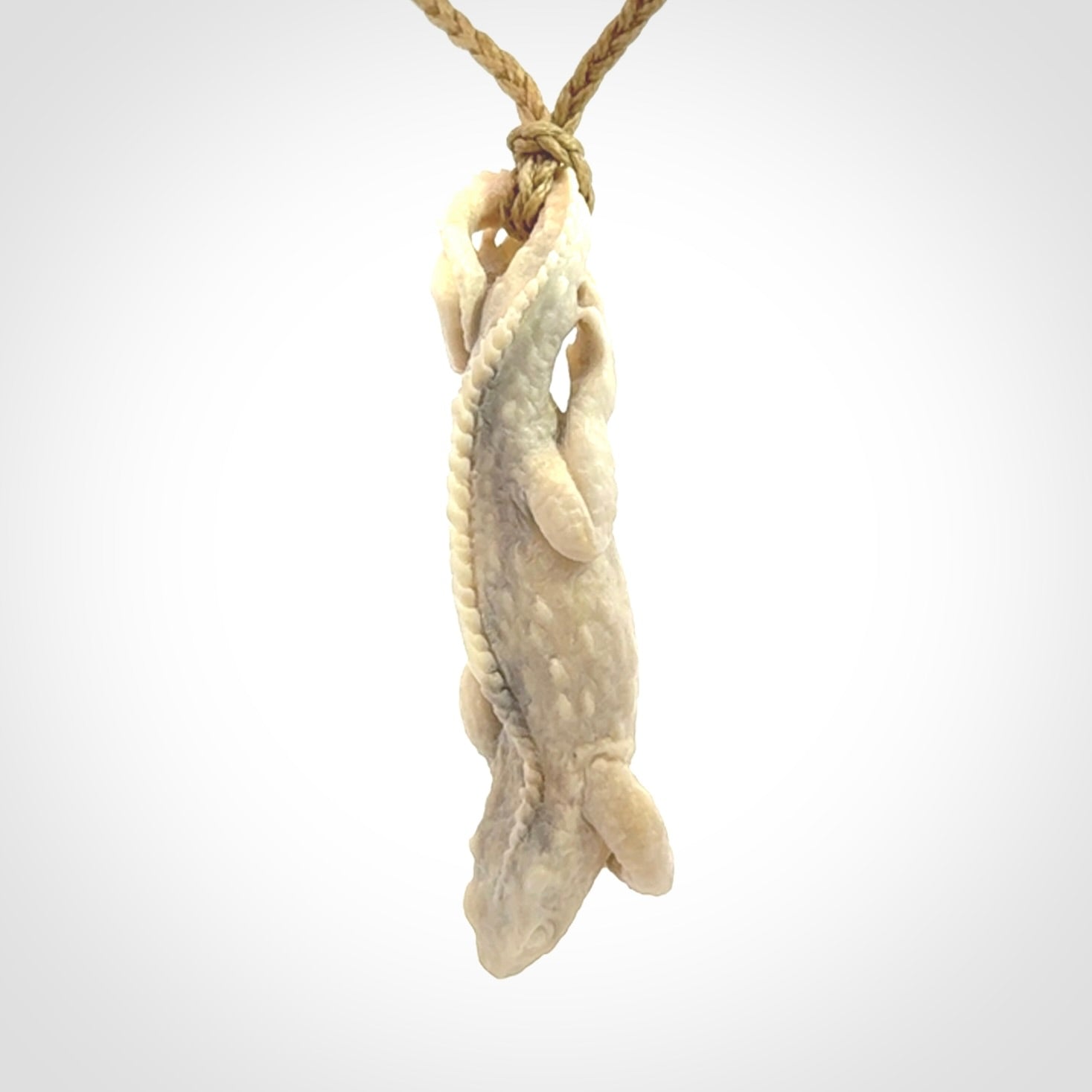 Hand carved deer antler Tuatara pendant.