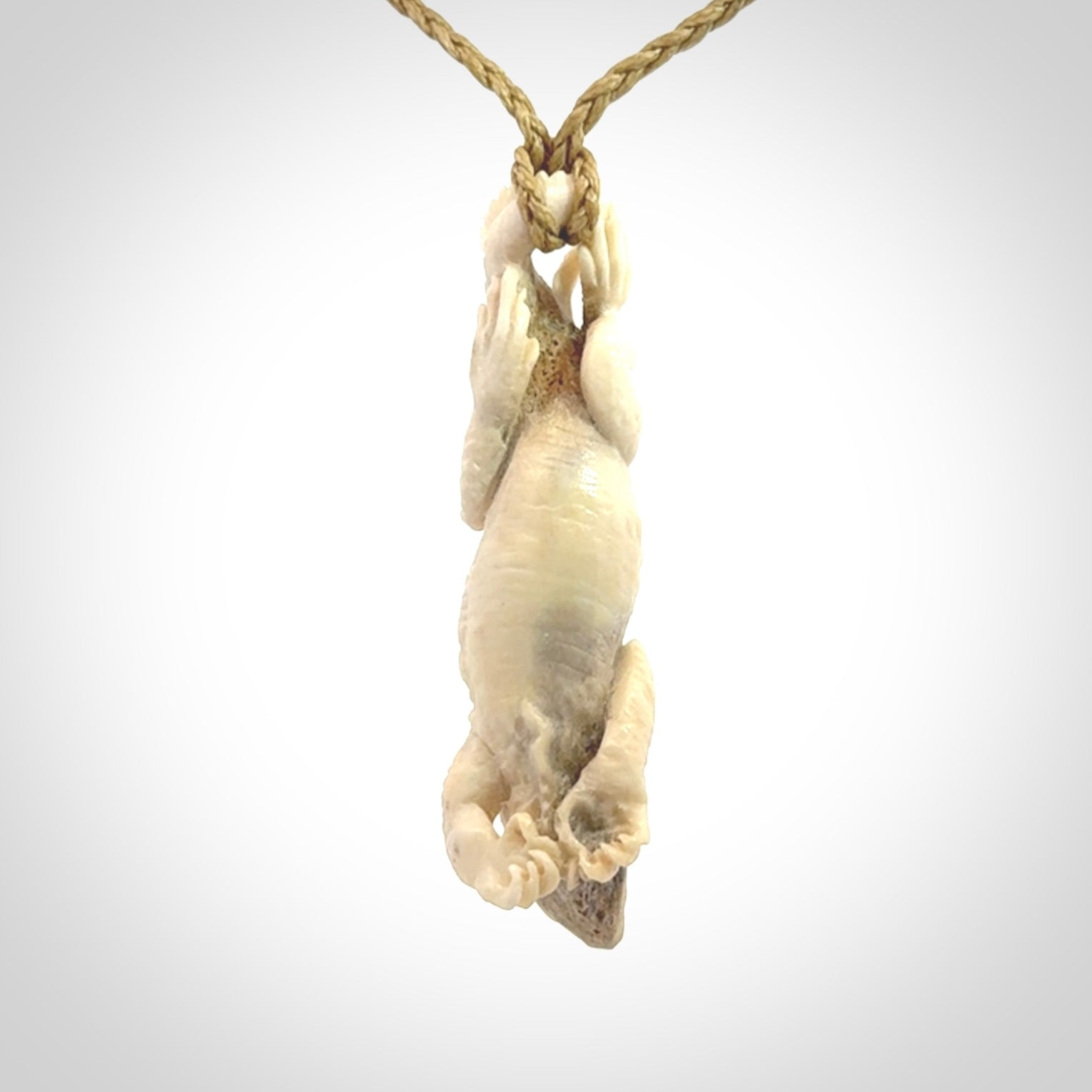 Hand carved deer antler Tuatara pendant.