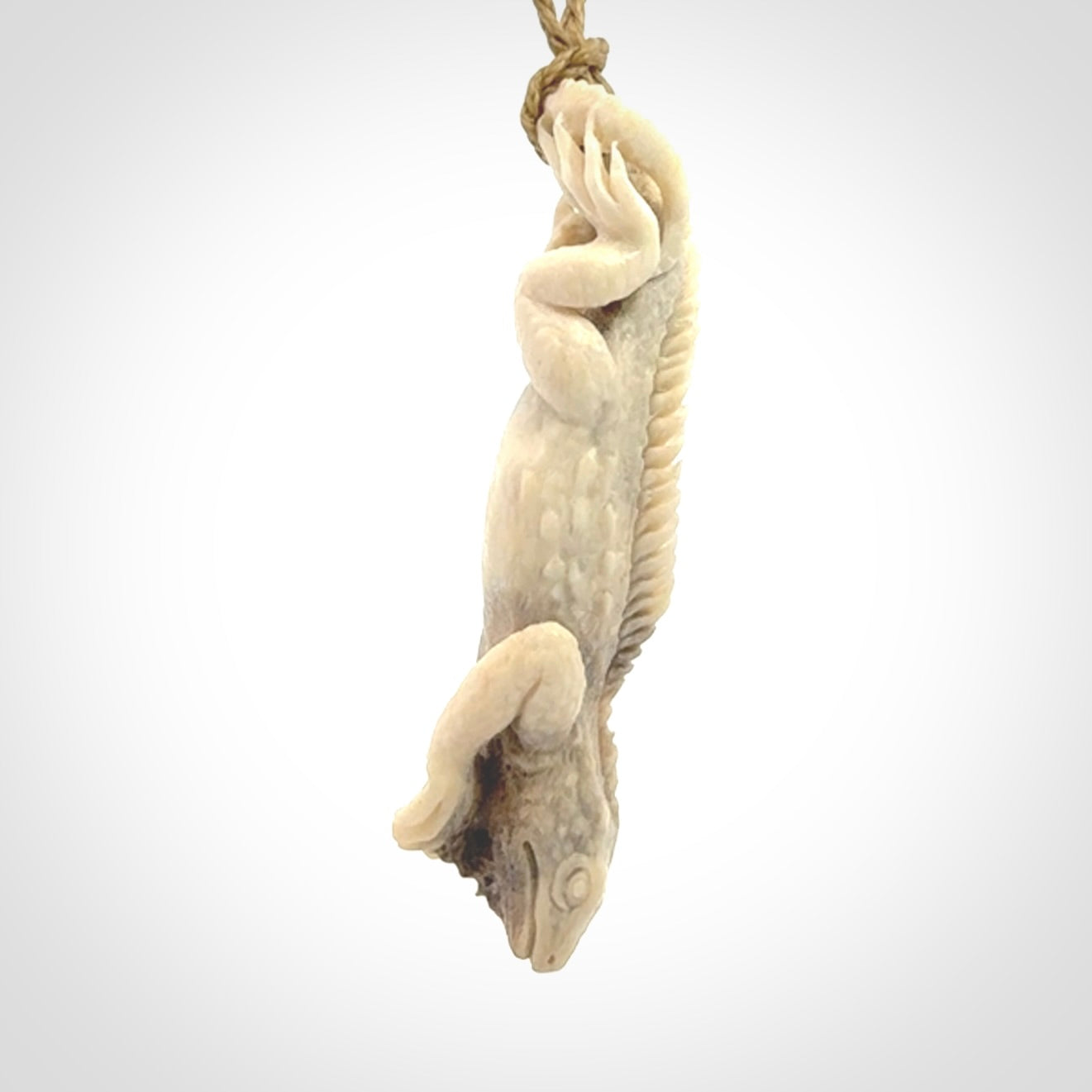 Hand carved deer antler Tuatara pendant.