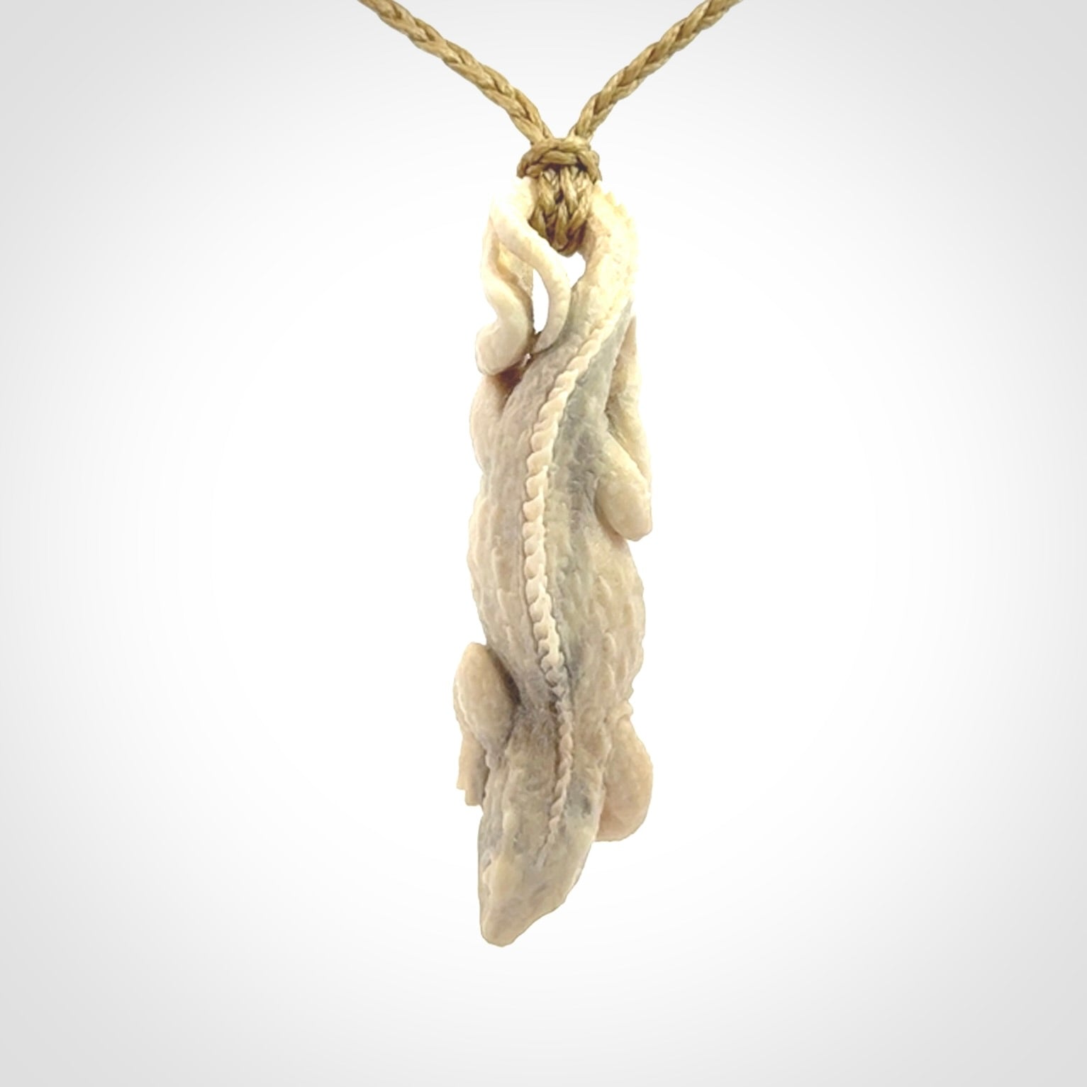 Hand carved deer antler Tuatara pendant.