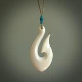 A fish hook necklace (hei-matau) hand-carved in a traditional style from Bone. These are glorious pieces!