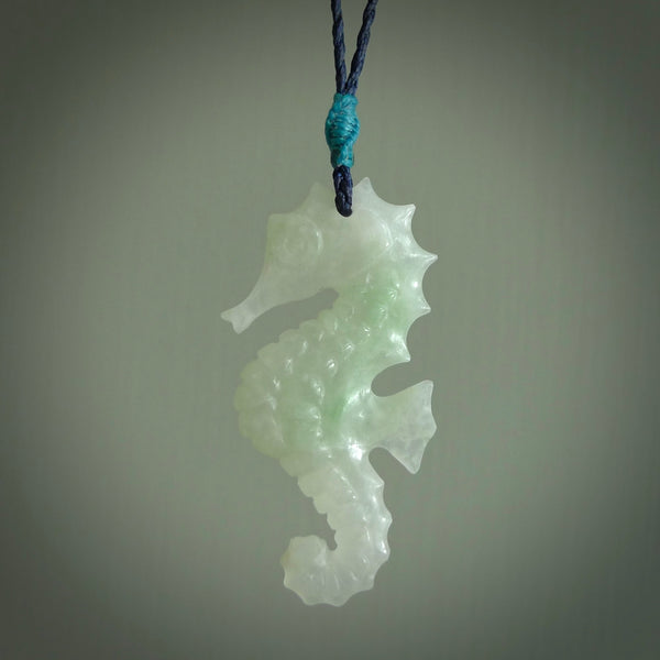 A hand carved Jadeite seahorse pendant. We have carved this from beautiful jadeite and we bind them with our hand-plaited cords. The cords are a waxed polyester so they are durable and strong. We ship these worldwide with express courier anywhere in the world.