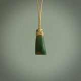 Hand carved jade toki by Ric Moor. Made in New Zealand by NZ Pacific. Hand carved Toki pendants crafted from beautiful New Zealand Pounamu, Jade. We deliver these with Express Courier, on adjustable cords.