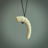 Hand carved huhu bug  pendant, carved for us by Fumio Noguchi. This piece is carved from bone and is a fantastic depiction of these bugs. This particular piece is a huhuh bug design and is lovingly carved. Free shipping worldwide.