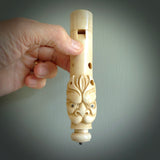 A contemporary hand carved flute. This piece is made from bone and is a fully functioning musical instrument and can be played. Beautiful art hand made by Yuri Terenyi. Flute with Dragons head.