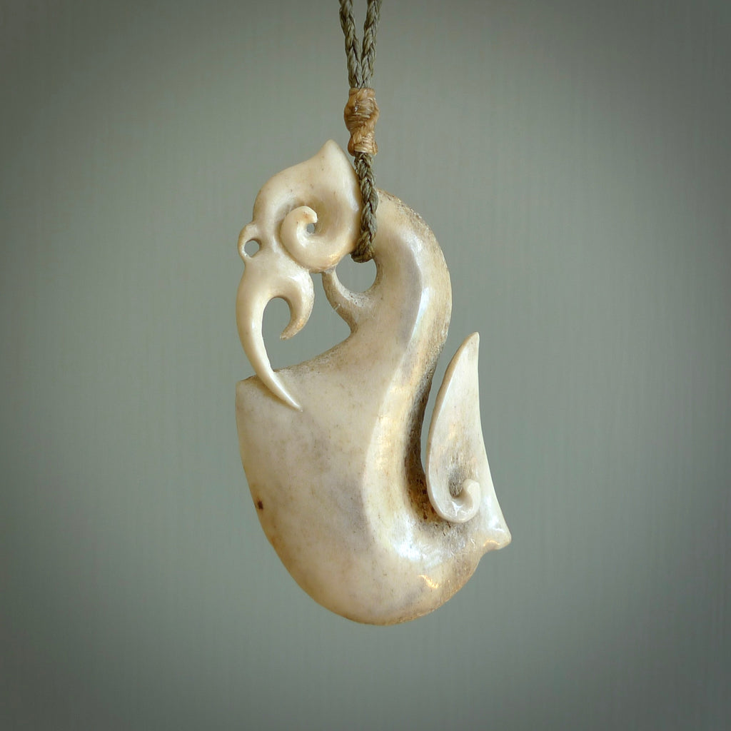 HAND CARVED DEER ANTLER MANAIA WITH HOOK AND KORU PENDANT. BONE MANAIA – NZ  Pacific