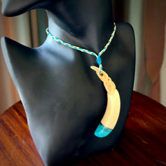 Hand carved Boars Tusk pendant with Turquoise, copper and Paua Shell. Engraved large boars tusk pendant. Unisex necklace hand carved by Andrew Doughty here in New Zealand. Unique art to wear. Delivered with an adjustable oat and cobalt blue cord.