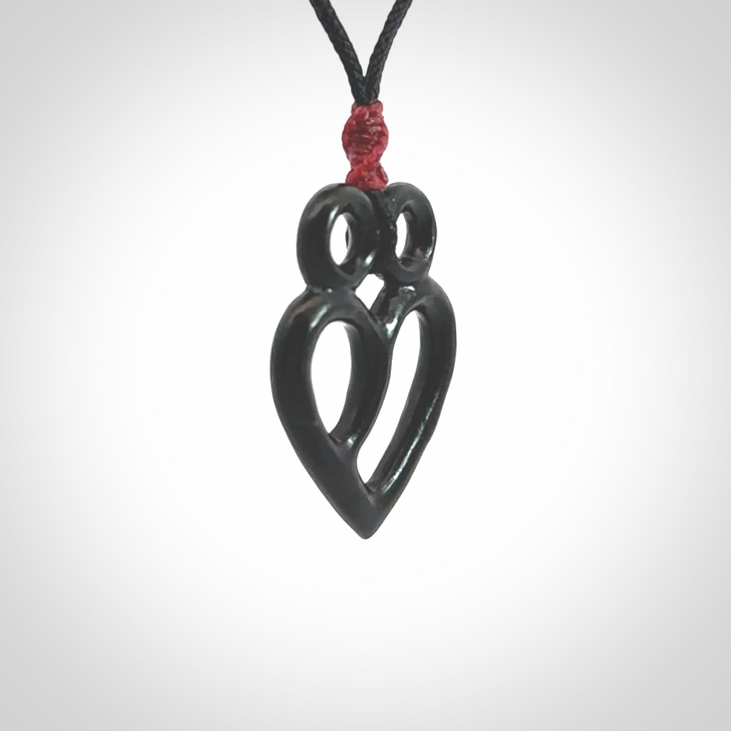 This is a hand carved love heart pendant made from a gorgeous and striking piece of Black Jade stone. This is a superbly carved and very unique piece if custom jewellery. For sale online from NZ Pacific.