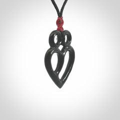 This is a hand carved love heart pendant made from a gorgeous and striking piece of Black Jade stone. This is a superbly carved and very unique piece if custom jewellery. For sale online from NZ Pacific.
