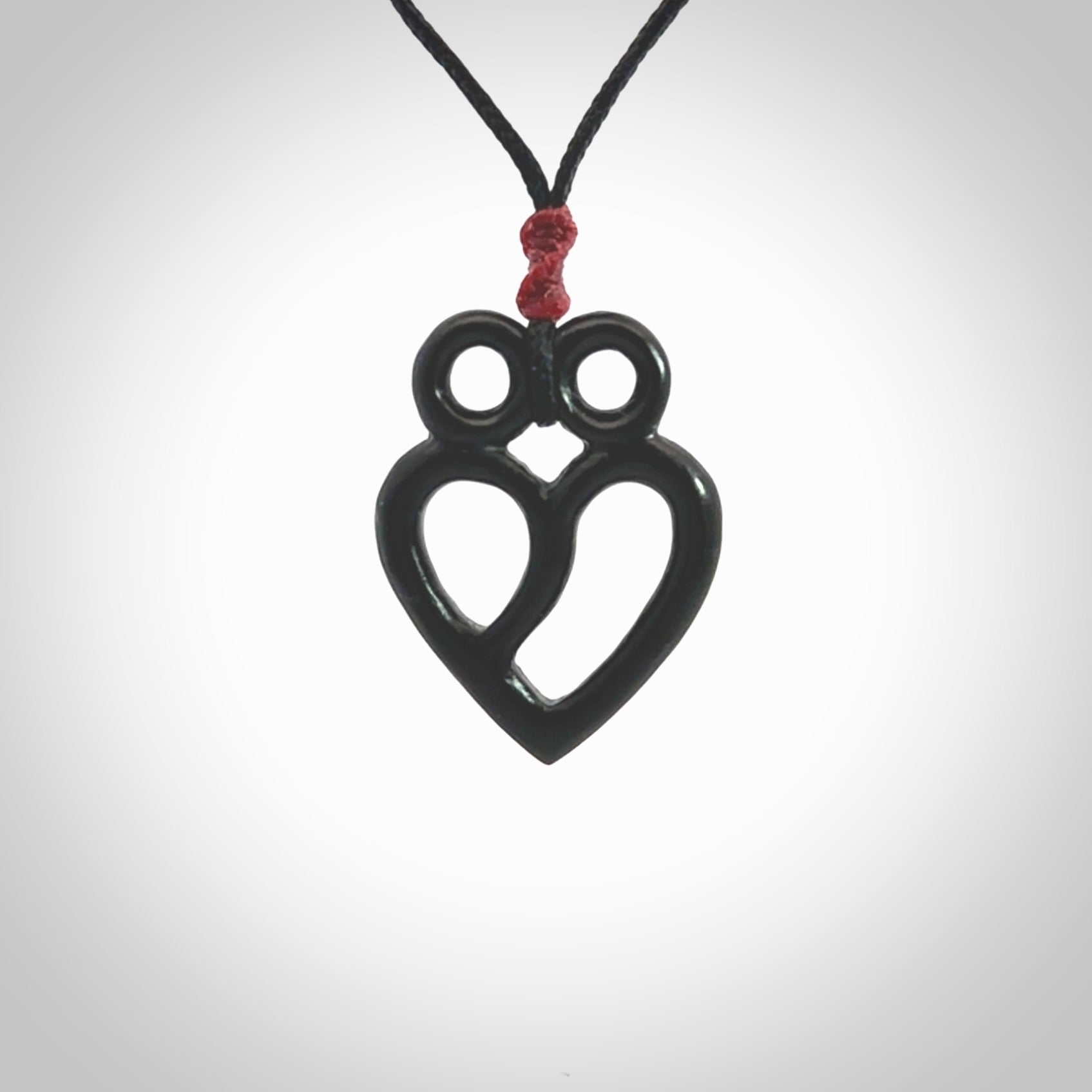 This is a hand carved love heart pendant made from a gorgeous and striking piece of Black Jade stone. This is a superbly carved and very unique piece if custom jewellery. For sale online from NZ Pacific.
