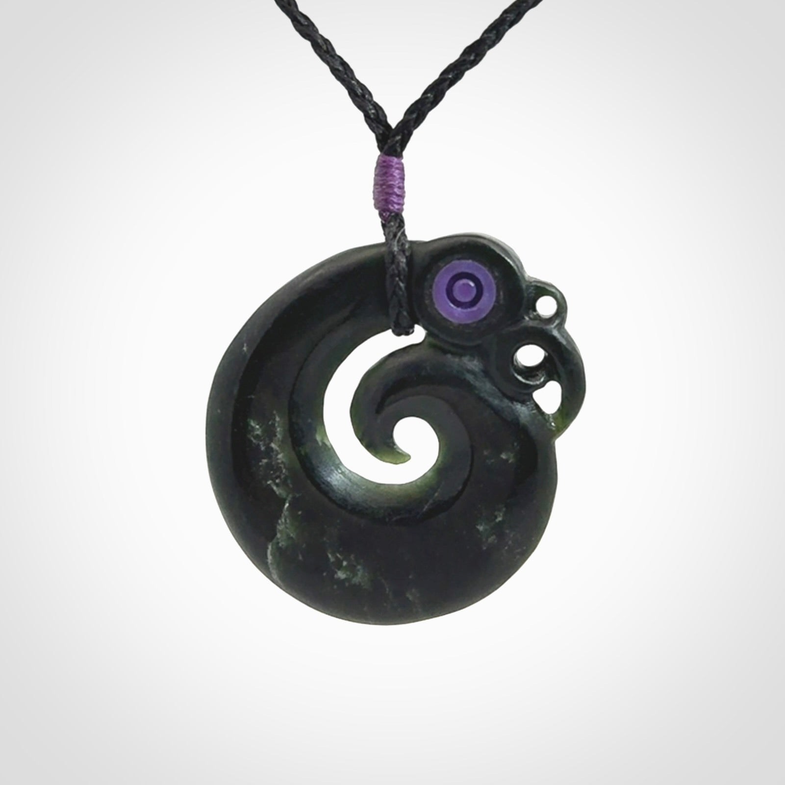 New Zealand Koru Manaia. Hand carved koropepe pendant. Made in New Zealand. Real Jade, pounamu.