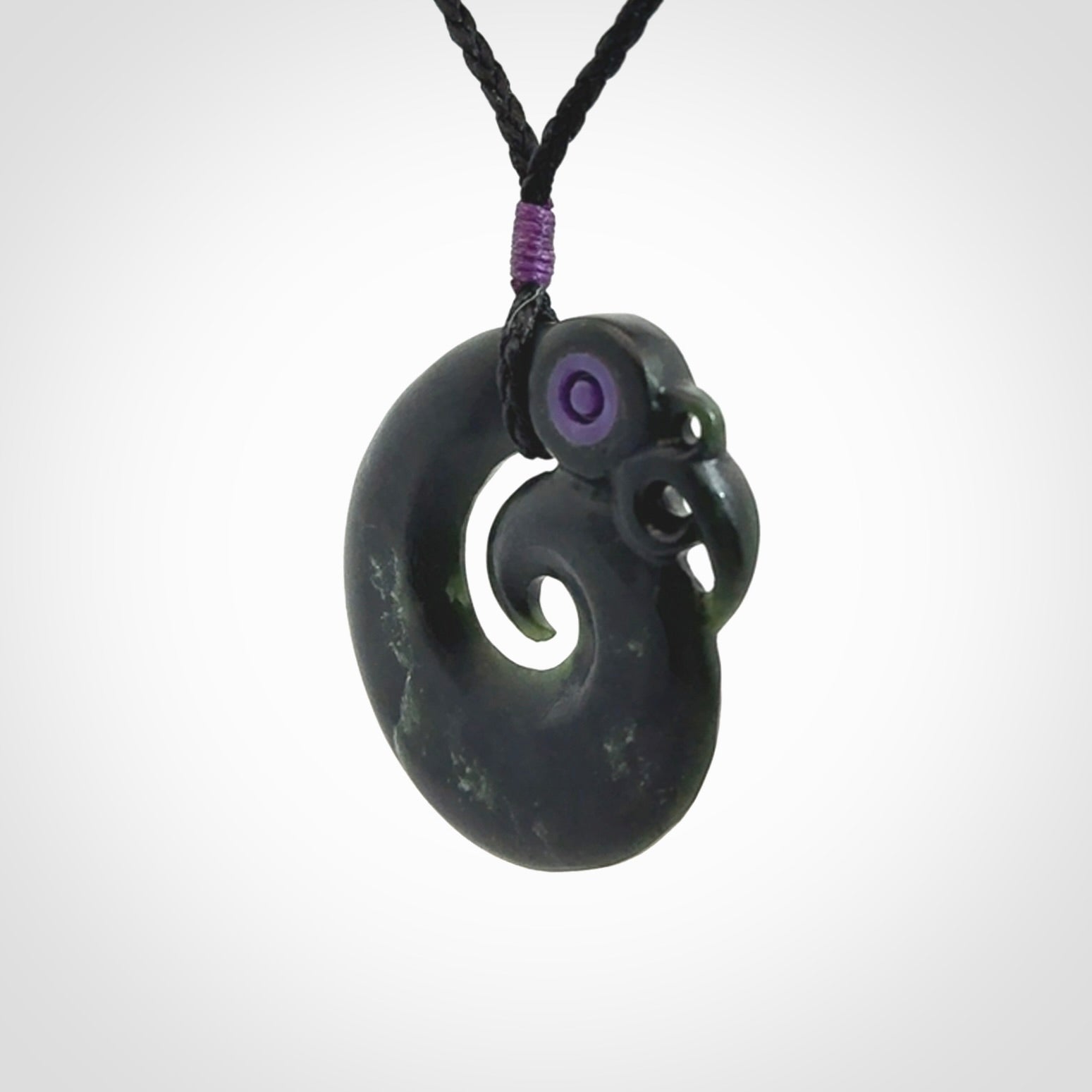 New Zealand Koru Manaia. Hand carved koropepe pendant. Made in New Zealand. Real Jade, pounamu.