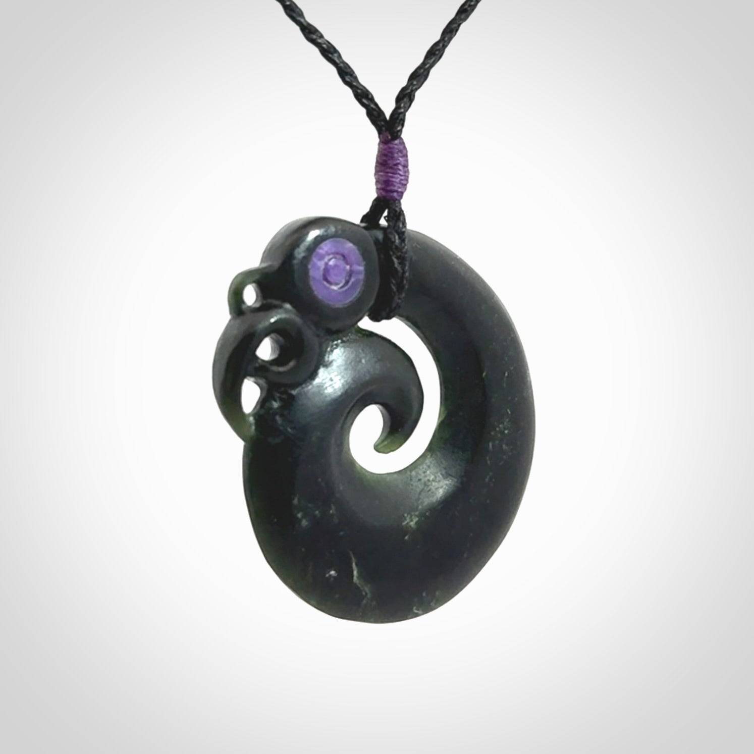 New Zealand Koru Manaia. Hand carved koropepe pendant. Made in New Zealand. Real Jade, pounamu.