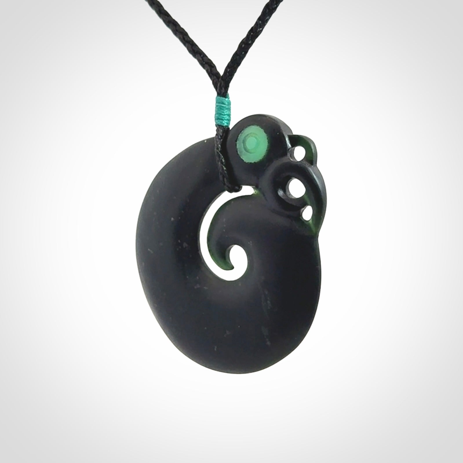 New Zealand Koru Manaia. Hand carved koropepe pendant. Made in New Zealand. Real Tangiwai, pounamu.