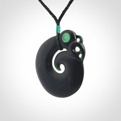 New Zealand Koru Manaia. Hand carved koropepe pendant. Made in New Zealand. Real Tangiwai, pounamu.