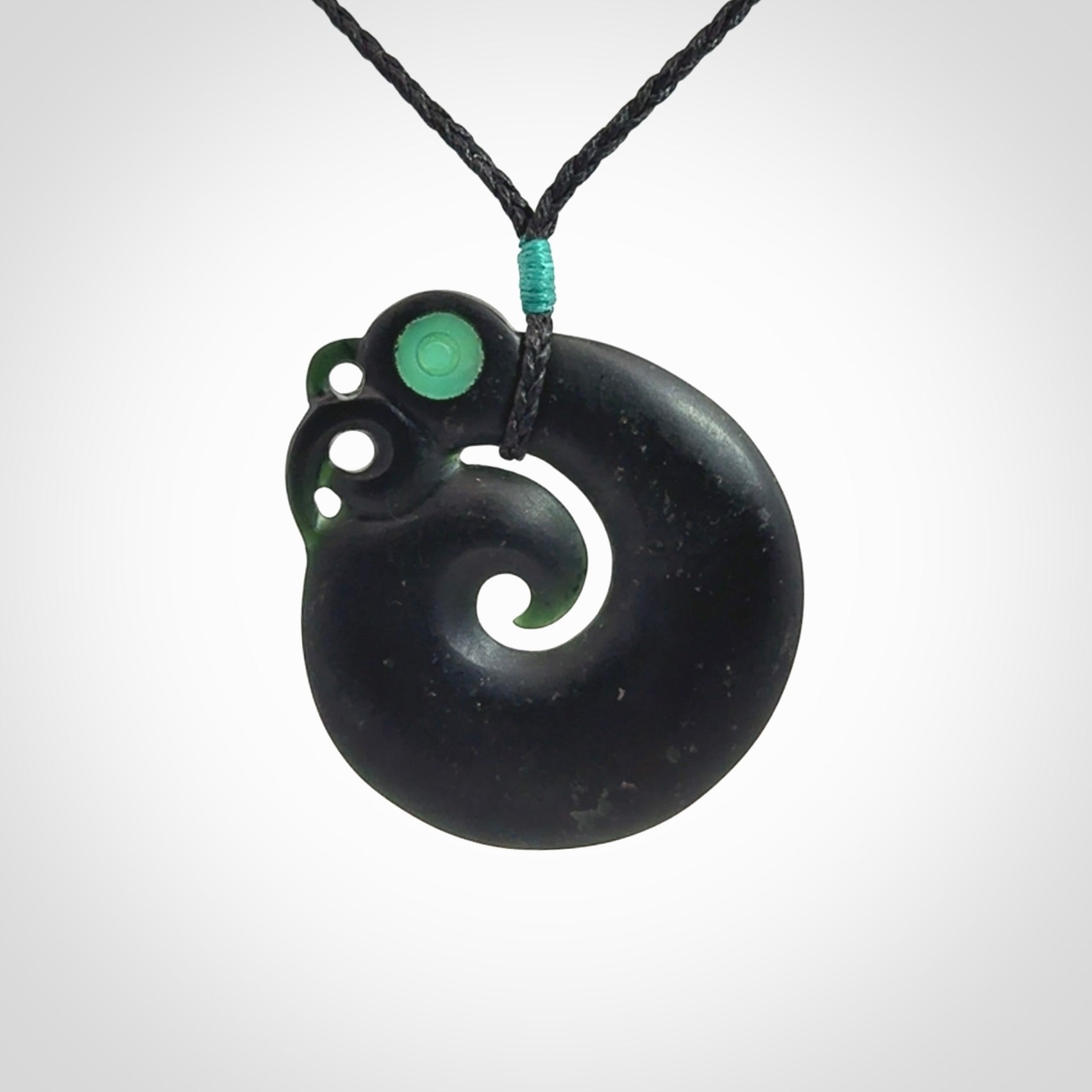 New Zealand Koru Manaia. Hand carved koropepe pendant. Made in New Zealand. Real Tangiwai, pounamu.