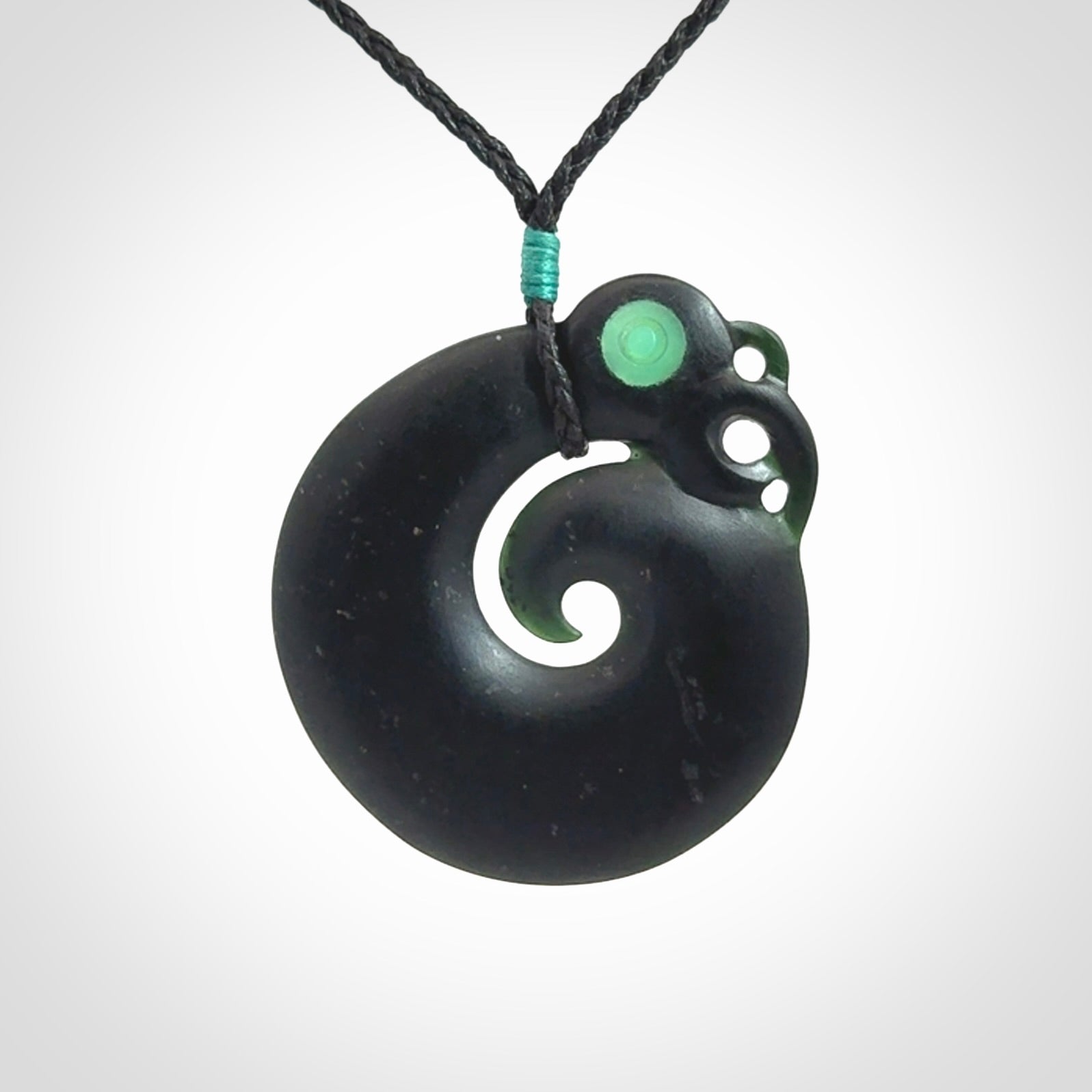 New Zealand Koru Manaia. Hand carved koropepe pendant. Made in New Zealand. Real Tangiwai, pounamu.