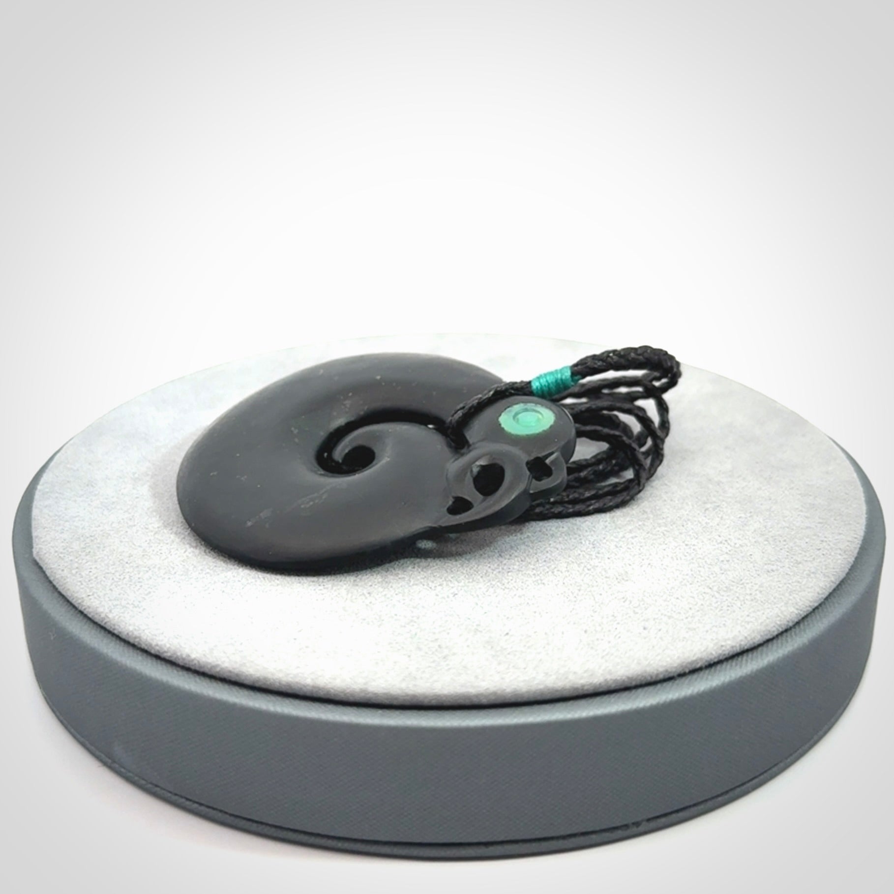 New Zealand Koru Manaia. Hand carved koropepe pendant. Made in New Zealand. Real Tangiwai, pounamu.