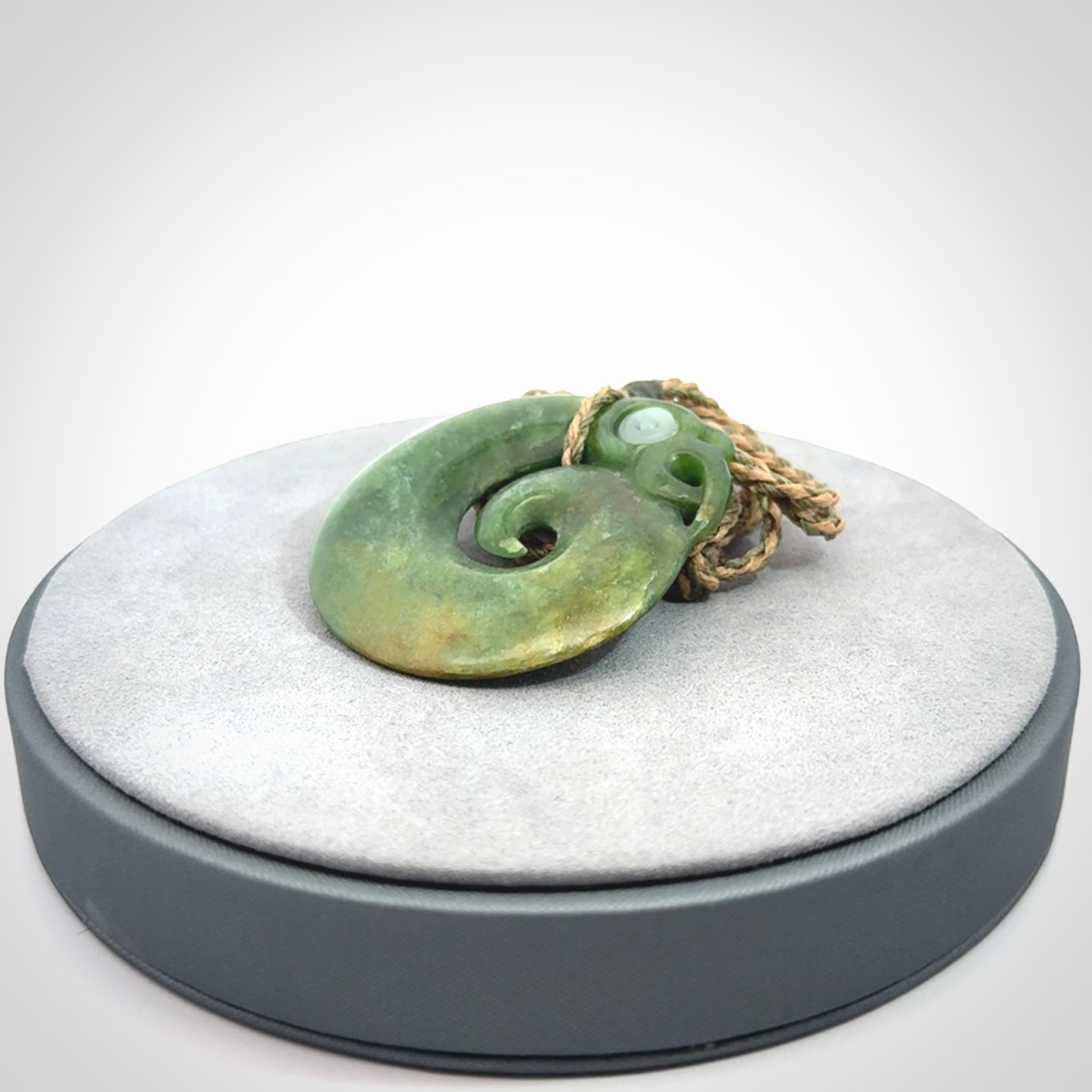 New Zealand Koru Manaia. Hand carved koropepe pendant. Made in New Zealand. Real Jade, pounamu.