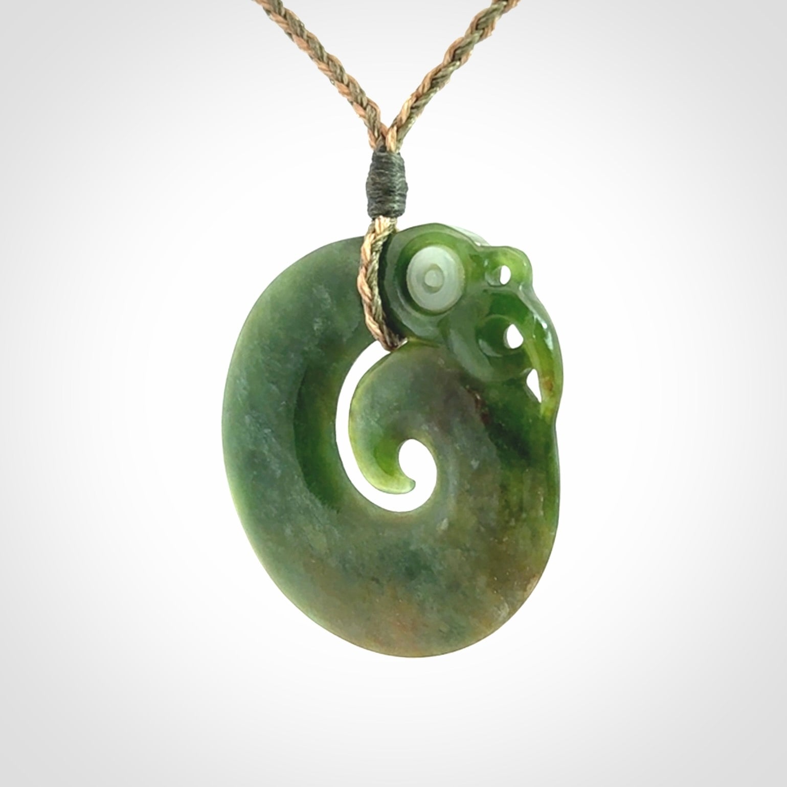 New Zealand Koru Manaia. Hand carved koropepe pendant. Made in New Zealand. Real Jade, pounamu.