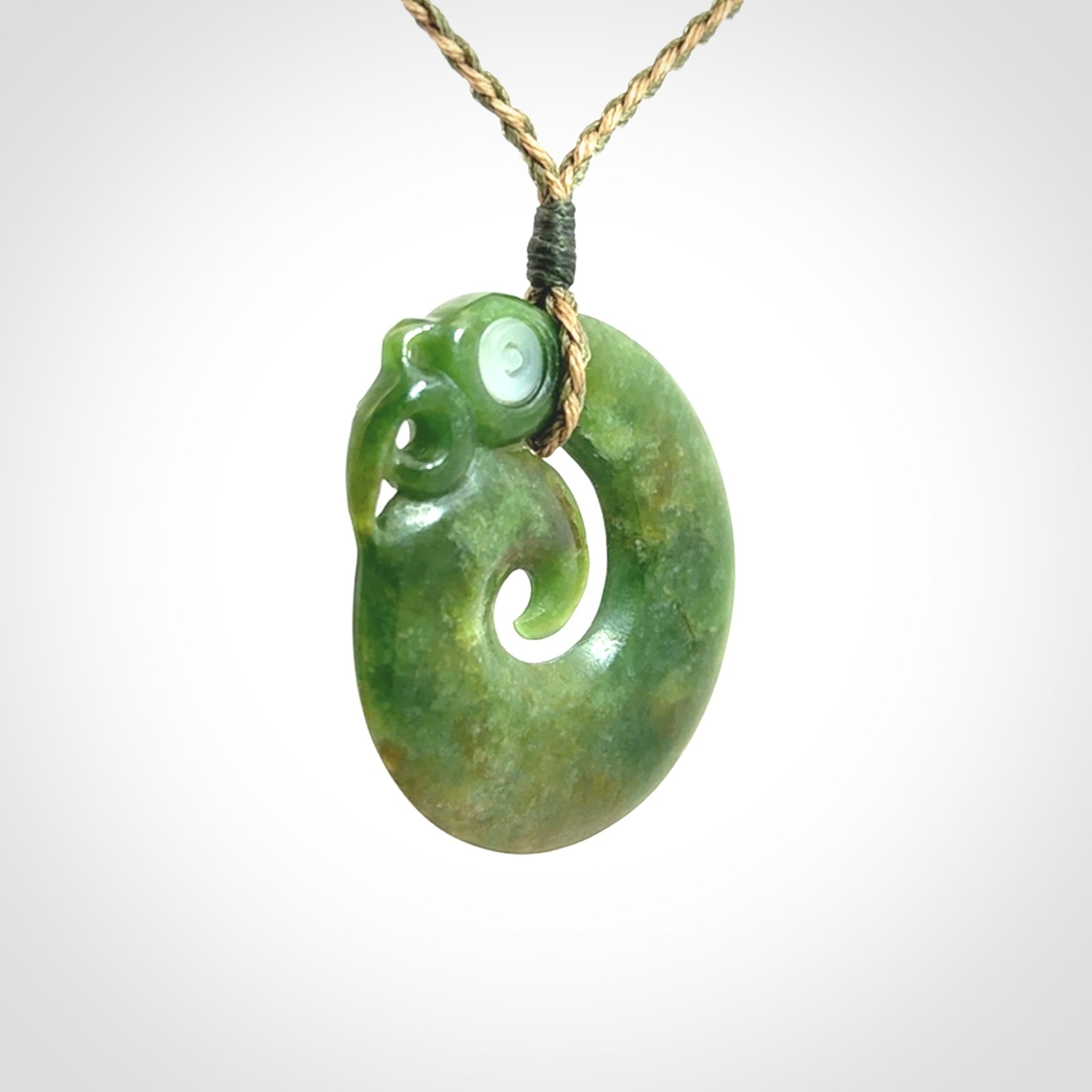 New Zealand Koru Manaia. Hand carved koropepe pendant. Made in New Zealand. Real Jade, pounamu.