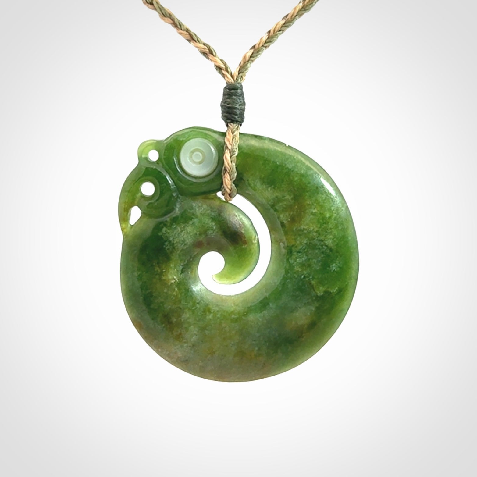 New Zealand Koru Manaia. Hand carved koropepe pendant. Made in New Zealand. Real Jade, pounamu.
