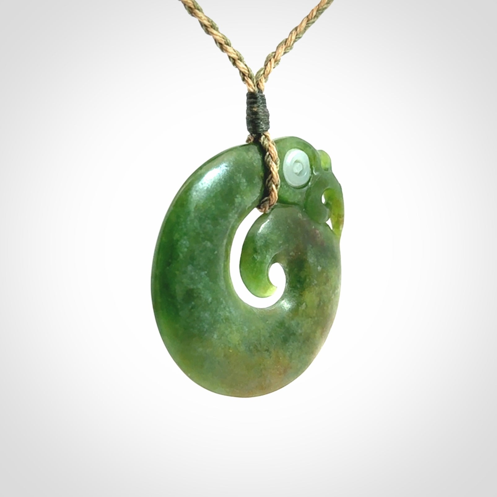 New Zealand Koru Manaia. Hand carved koropepe pendant. Made in New Zealand. Real Jade, pounamu.